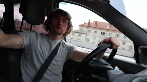 Aggressive driver shouts and gestures angrily at other motorists Stock Footage 343720134