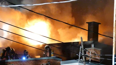Aggressive flames on the roof Stock Footage 115933214