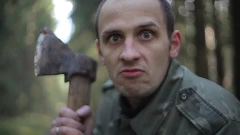 Aggressive forest maniac with an axe Stock-Footage 90093943