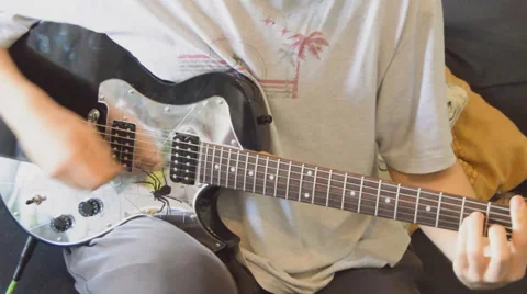 Aggressive Guitar Strumming Stock Footage 63393656
