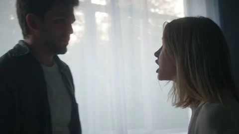 Aggressive man holding head of scared woman, couple shouting and fighting in Stock Footage 156765160