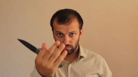 Aggressive man with a knife Stock Footage 65813279