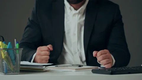 Aggressive man writing notes, feeling stress at work concept. Mad impulsive Stock Footage 228686540