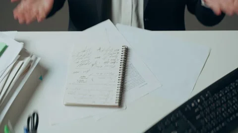 Aggressive man writing notes, feeling stress at work concept. Mad impulsive Stock Footage 235722379