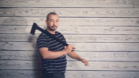 Aggressive maniac with an axe Stock Footage 96679303