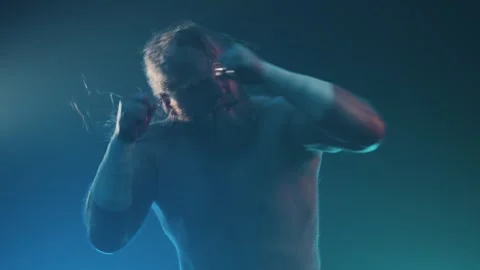Aggressive pro wrestler throwing punches Stock Footage 336802297