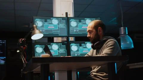 Aggressive violent hacker trying to hack network in office 库存照片