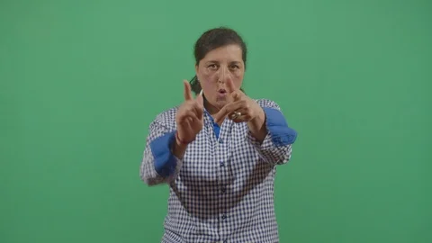 Aggressive woman executing the viewer with the hand in shape of a gun in ecuador Video stock 115336813