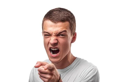 Aggressive young man points his finger. Stock Photos