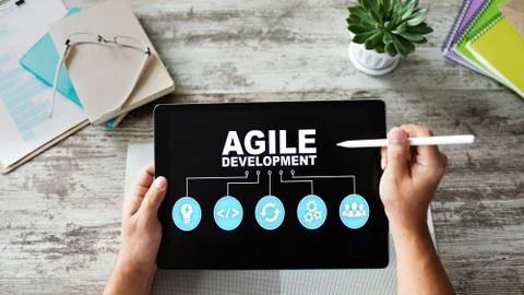 Agile development concept on the device screen. Stockfoto's