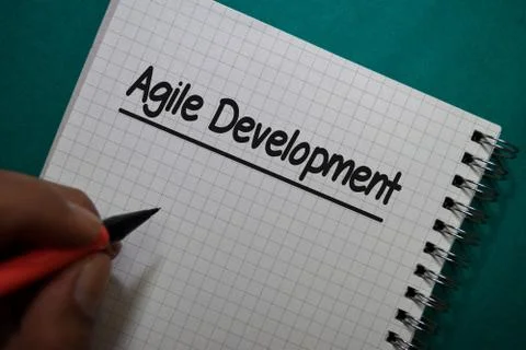 Agile Development write on a book isolated on Office Desk 스톡 사진