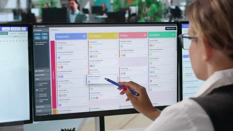Agile Project Manager Reviews Task Board And Updates Schedule Stock-Footage 342971544