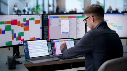 Agile Project Manager Updating Scrum Board While Using Laptop Stockbeeldmateriaal 340397639