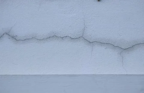 Aging cement wall cracks old and dirty at the outside at home Stock Photos