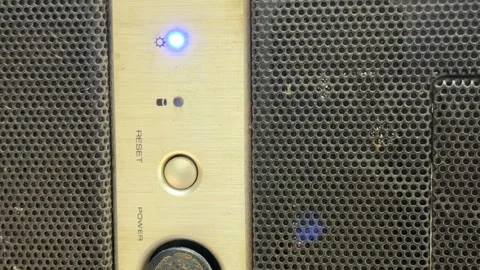 Aging Computer Revives with a Reluctant Groan and Dusty Whir Stock Footage 328917666