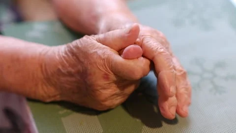 Aging process - very old senior woman hands wrinkled skin Stock Footage 254961647