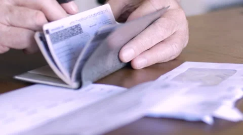 An aging senior balances his checkbook Video stock 61627622