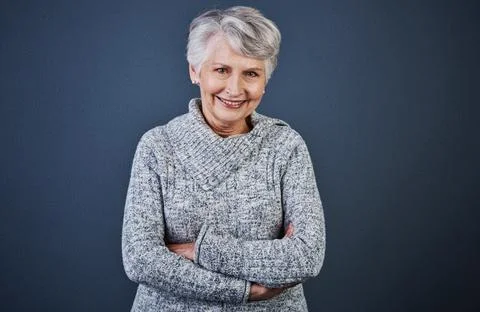 Aging is a wonderful process. Studio shot of a cheerful elderly woman standing Stock Photos