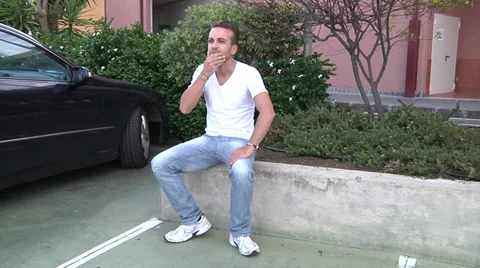 Agitated man make a call with a mobile phone. Stock Footage 31543251