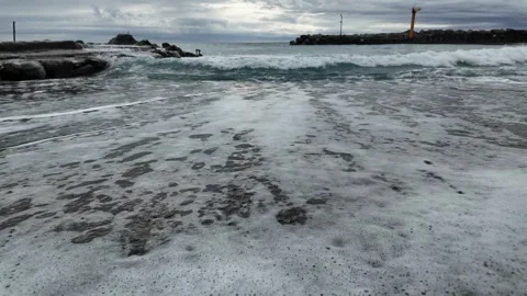 Agitated ocean washes shores on cloudy winter day in Bogliasco village. Stock Footage 327072409
