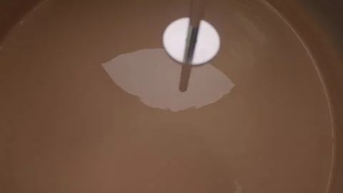 Agitation of Liquid in Container During Laboratory Process Stock Footage 338424007
