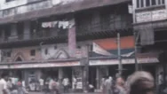 Agra, India - 1976: Crowd Indian People Walk On The Street In Agra City Stock Footage