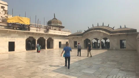 Agra, India, November 10, 2019, Agra Fort, tourists inspect the ancient walls of Stock Footage 123793244
