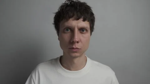 Agreeing with a confident nod looking at camera Stock Footage 323438187