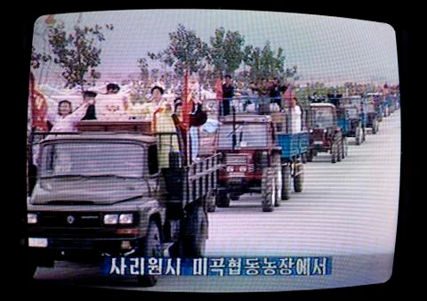 Agricultors parading on the North Korean television, Pyongan Province, Pyongy Stock Photos
