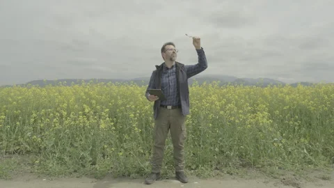 Agricultural engineer evaluating biofuel sample, ungraded flat profile 動画素材 336280045