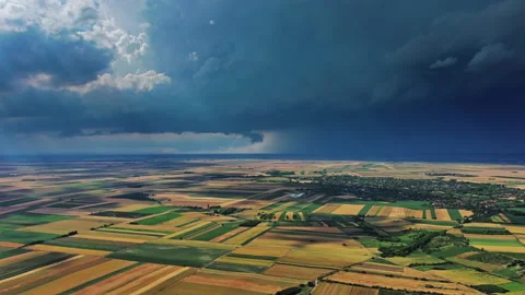 Agricultural farmland under dramatic dark storm clouds Stock Footage 344744317