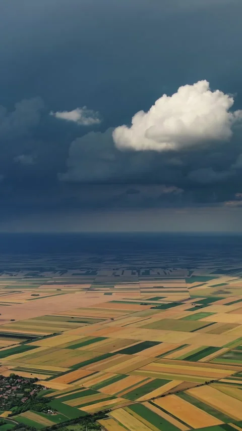 Agricultural farmland under dramatic dark storm clouds Stock Footage 346651392