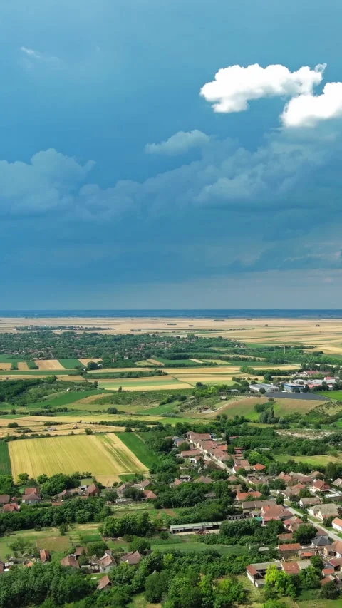 Agricultural farmland under dramatic dark storm clouds Stock Footage 346653538