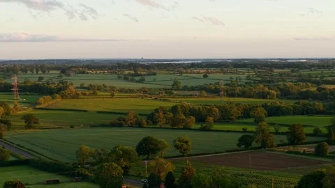 Agricultural fields and power lines across rural countryside. Aerial panorama of Video stock 336969015