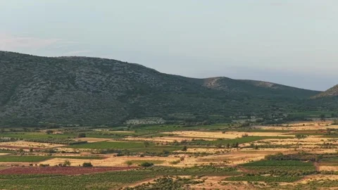 Agricultural fields and rolling hills in Opoul Perillos, France, with wind Stock Footage 346724284