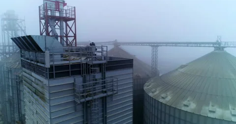 Agricultural huge elevator containers. Big grain elevator containers aerial view Stock Footage 168751492