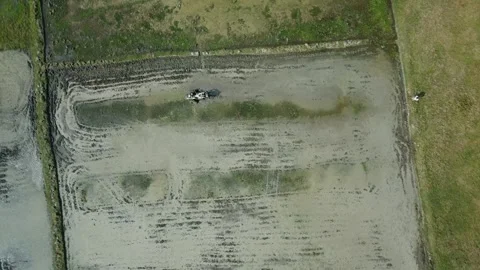 Agricultural land preparation using power tiller machine for crop cultivation Stock Footage 327571898