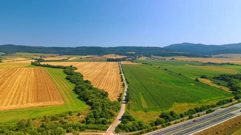 Agricultural landscape with colorful patchwork fields. Aerial photograph shows Stock Footage 346191312