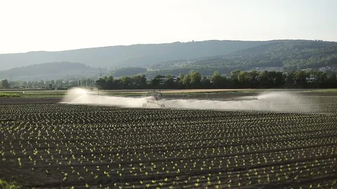 Agricultural machine for irrigation of fields. Automatic watering in the village Video stock 103653121
