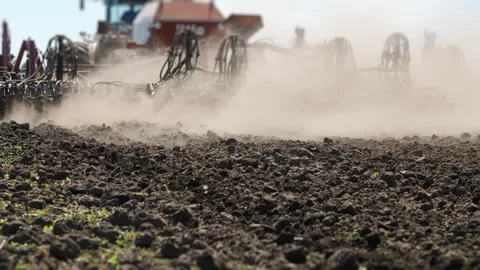 Agricultural Seeder Working In Dust During Spring Field Operations Stock Footage 345021899