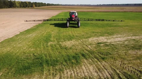 Agricultural sprayer on the field. preparation for work. Drone view Stock Footage 162908817