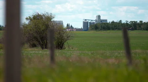 Agricultural storage facility with field in the foreground. Stock Footage 67612933