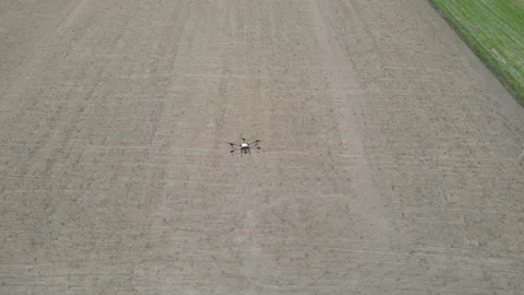 Agricultural technology drones.Drone spraying over fields. Stock Footage 157079275
