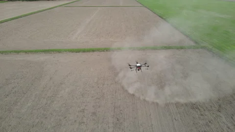 Agricultural technology drones.Drone spraying over fields. Stock Footage 157079322