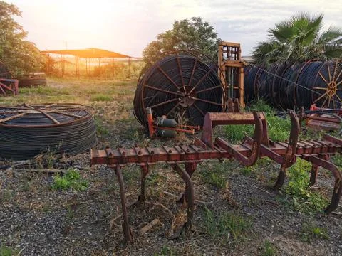 Agricultural tools on sunset background Stock Photos