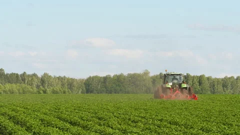 Agricultural tractor in the field Stock Footage 204029334