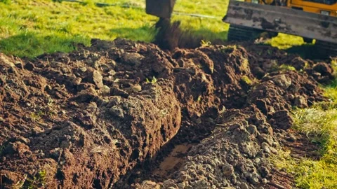 Agricultural Tractor or Excavator Digging - Rural Farmland - Norway Stockbeeldmateriaal 345021014