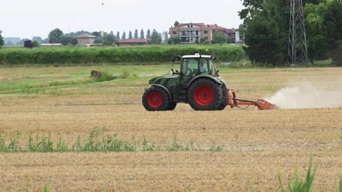 Agricultural tractor performs cultivation work with mechanized tools. Italy Stock Footage 161770229