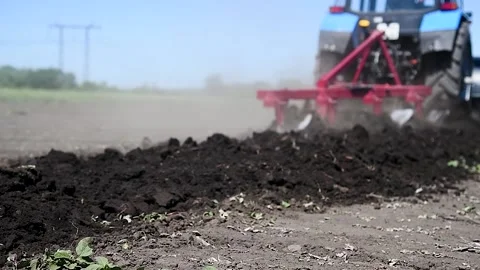 Agricultural tractor plowing a field Stock Footage 220618253