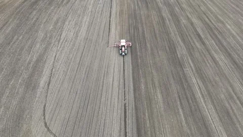 Agricultural Tractor Preparing Soil for Spring Crop Season Stock Footage 323021739